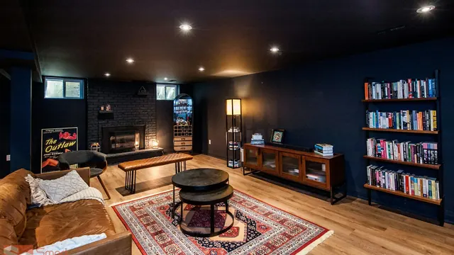 Custom fireplace surround with a hardwood mantel and flanking built-ins in Lexington KY