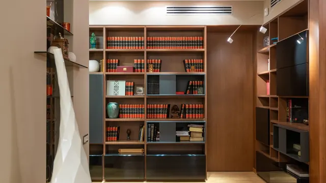 Custom home office built-ins with an integrated desk return and file storage in Lexington KY